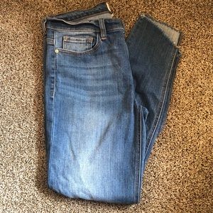 Medium wash raw hem distressed jeans